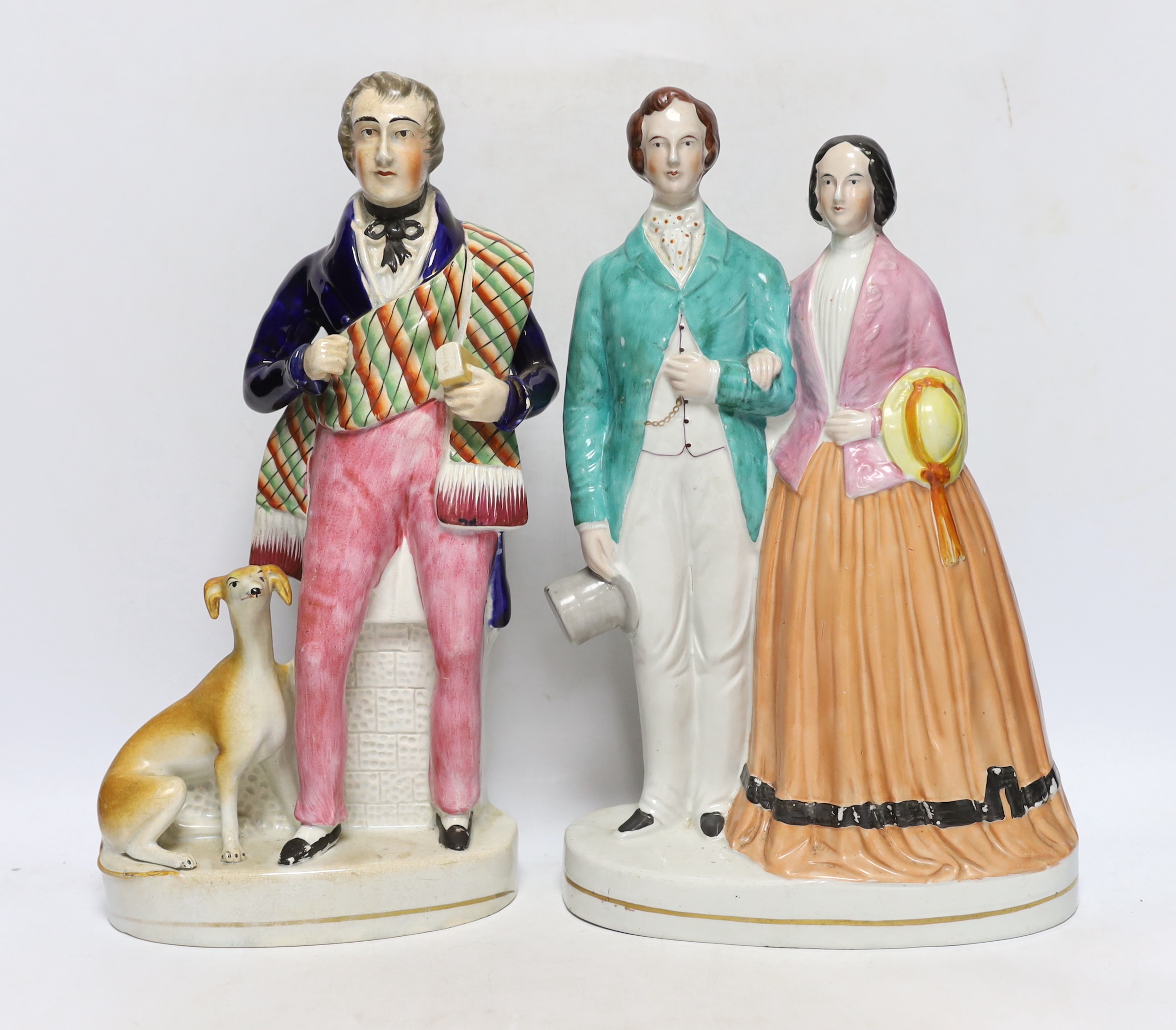 Four mid 19th century Staffordshire figure groups including Queen Victoria and Prince Albert, two individual figures of the Queen and Prince and Sir Walter Scott, tallest 36cm high